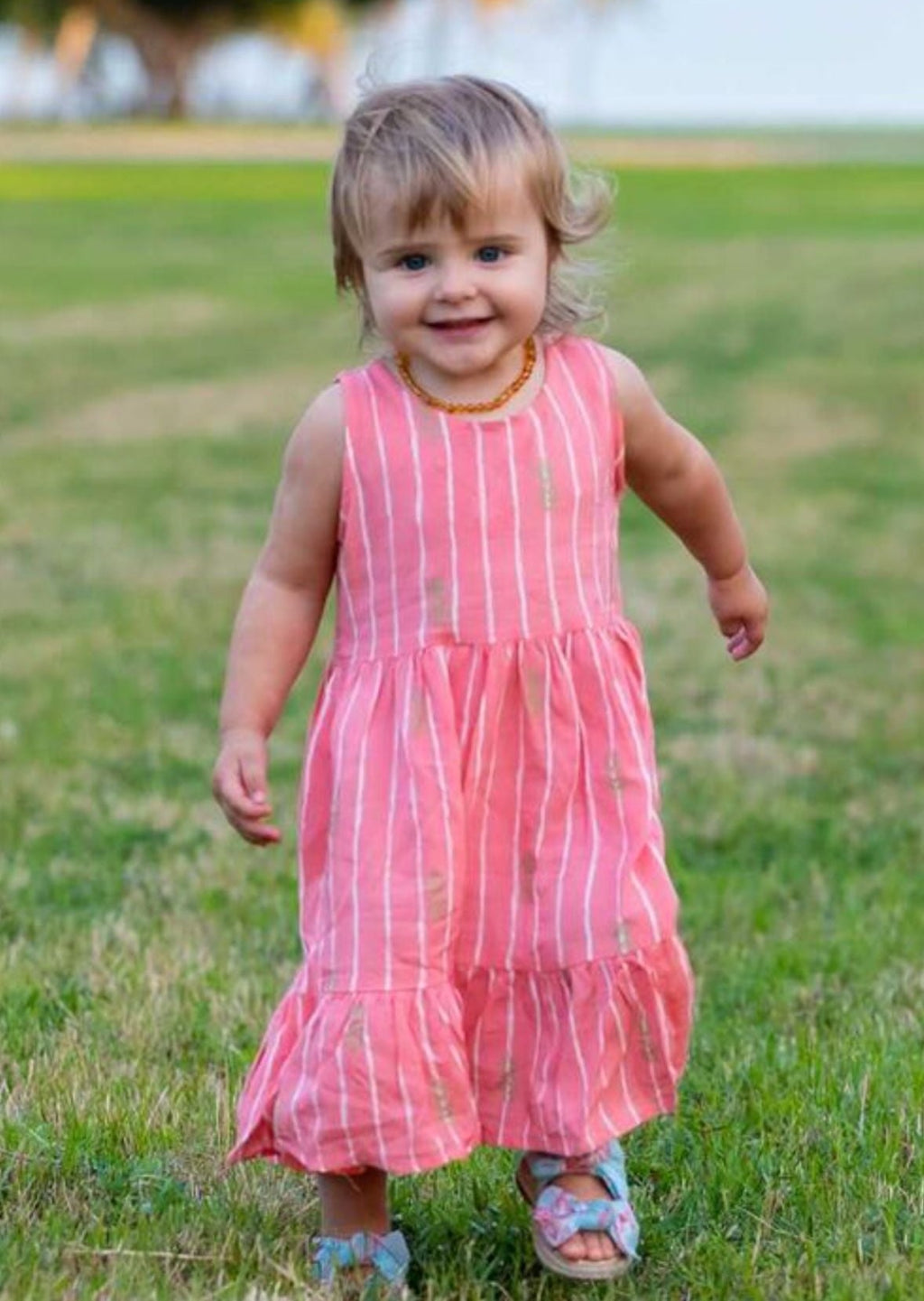 Girls pink dress with golden pineapples and white stripes 