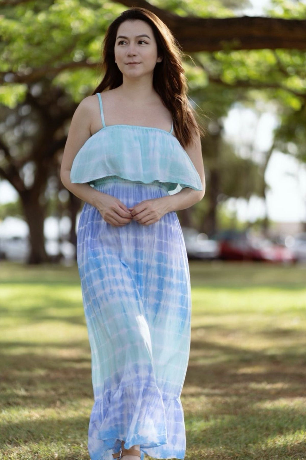 This Moana Long Hawaiian Dress in Rain is hand dyed and features adjustable straps for comfort that can be tucked in for a cleaner look.  This Moana Long Hawaiian Dress in Rain has a ruffle bounce overlay with an elastic bust for added support.   It is a known fact of the Hawaiian community that Moana is the Hawaiian word for Ocean. Since the ocean is the source of all life it is a powerful feminine power.