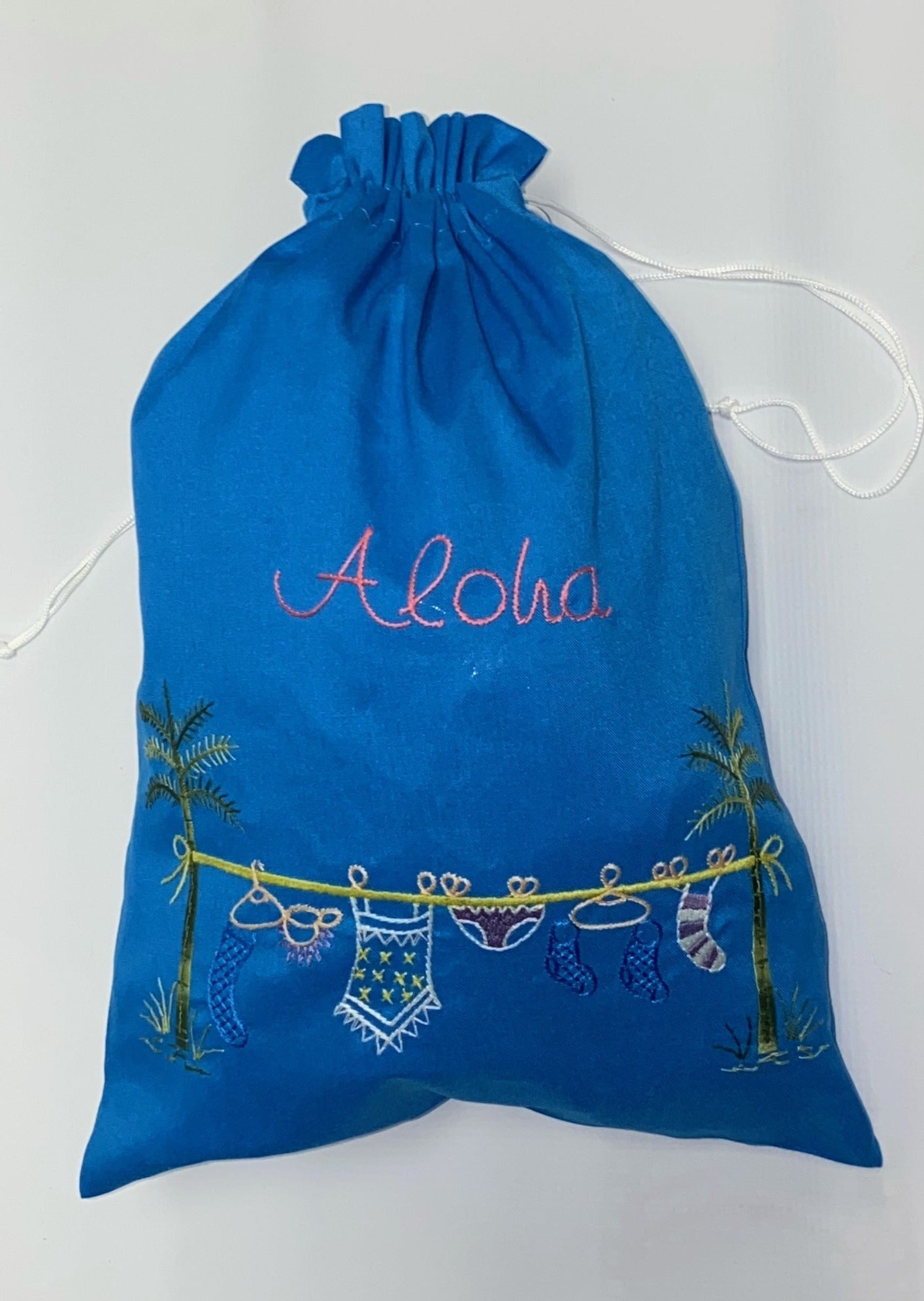 Clothesline Embroidered Travel Sack